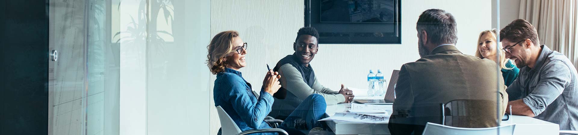 Business people discussing together in meeting at office.